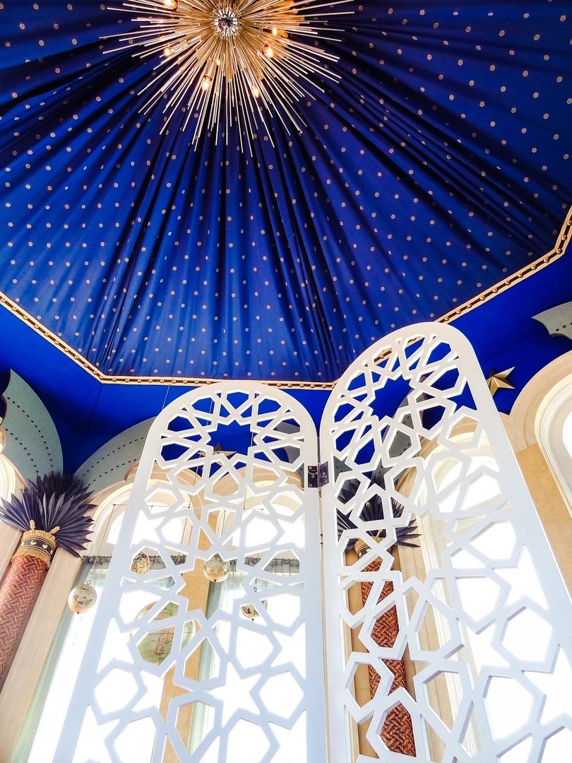 Deep blue ornate ceiling and white lattice interior
